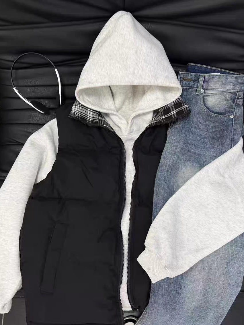 Doudoune Highland noire portée sur un hoodie gris avec un jean